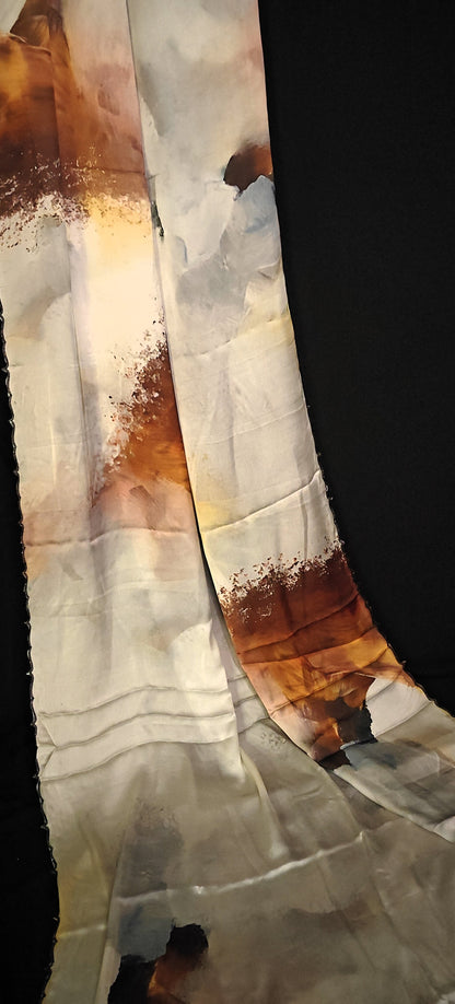 Brown-accented satin-georgette saree featuring artistic brushstroke patterns on white base with scalloped edge, stylish festive saree.