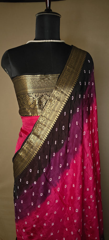 Magenta silk saree with broad golden zari border, styled on mannequin.