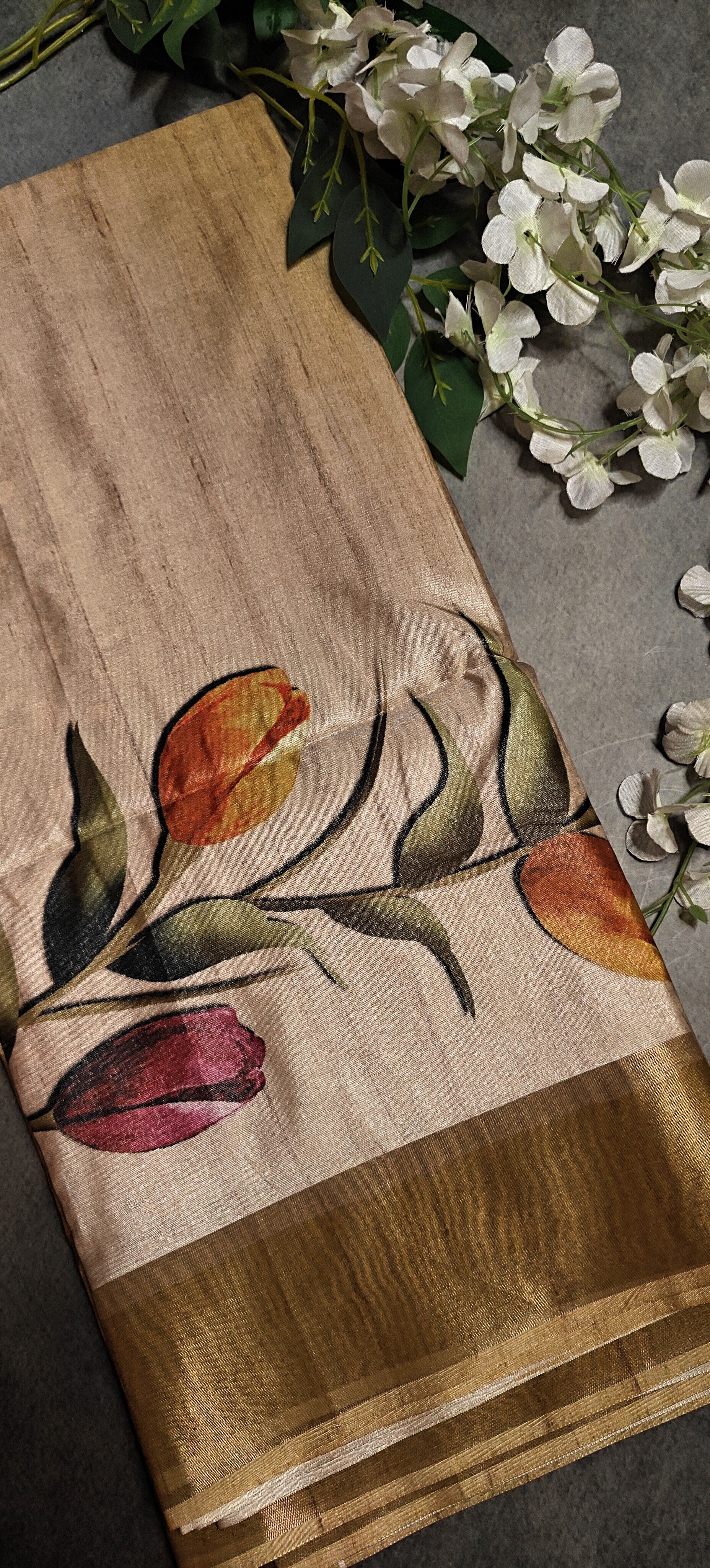 Peach viscose silk saree with delicate floral design, breathable and graceful ethnic wear.