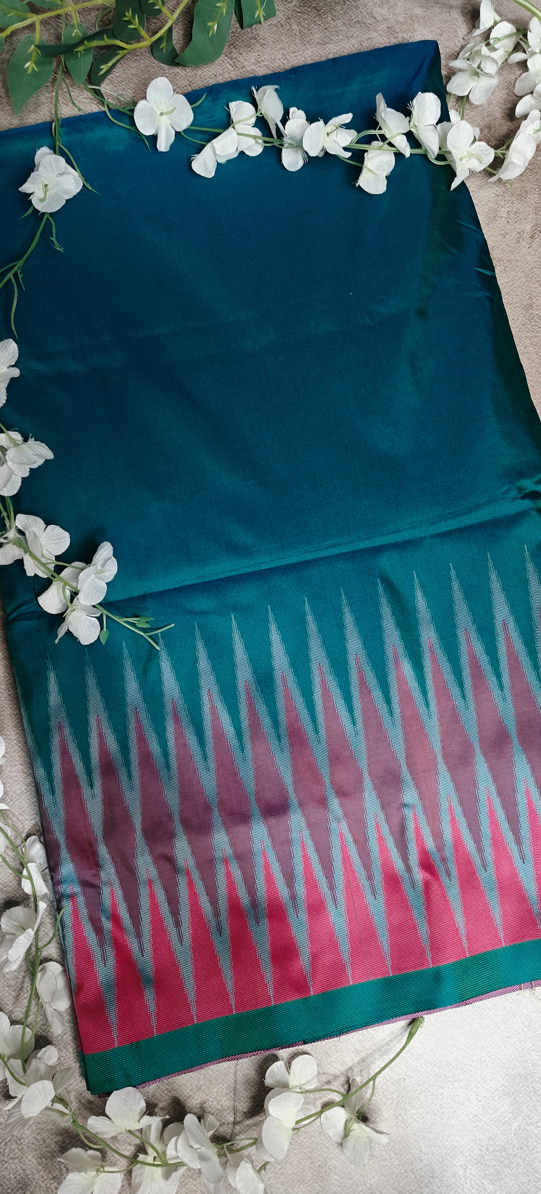 Peacock green viscose blended silk saree with elegant drape and subtle sheen.